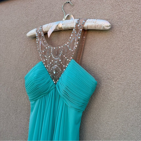 Beautiful long dress
In Aqua blue. - Picture 3 of 7